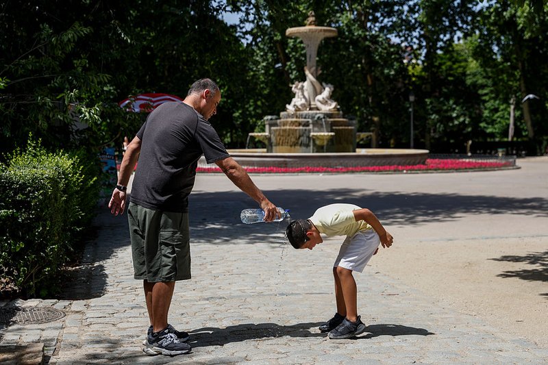 Child seeking relief from the heat in Europe