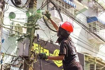a protester painting over a surveillance camera