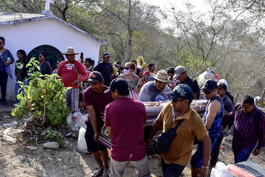 Relatives and friends carry the coffin at the funeral of environmental activist Marco Antonio Suastegui, who opposed the construction of a hydroelectric dam in the southern Mexican state of Guerrero.