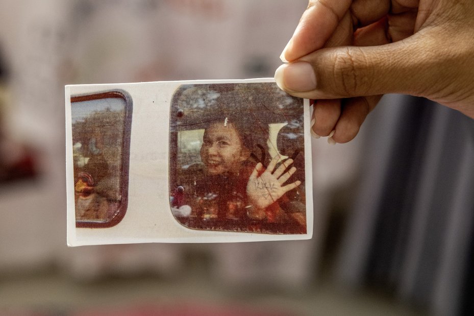 A photograph depicts the moment environmental activist Phuon Keoraksmey is transported to prison to serve a 14 month sentence after campaigning against destructive infrastructure projects and alleged corruption in Cambodia.