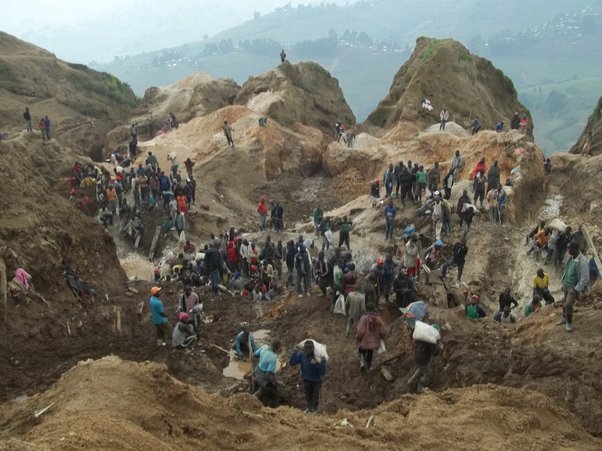 workers at coltan mine in rubaya area, drc